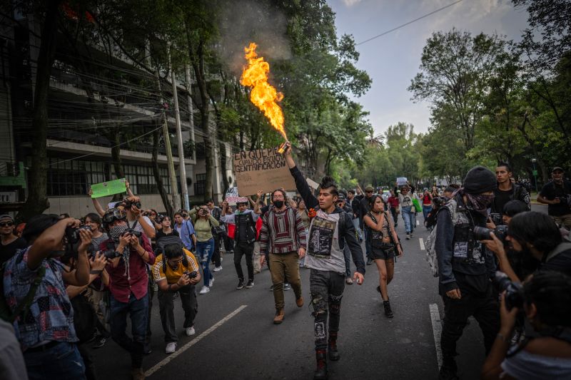 The words “Get out of Mexico” are still visible on one shop window as protestors violently kicked in the glass pane. In another clip, “Kill a gringo” is spray-painted on a wall in Mexico City as demonstrators carried placards demanding western foreigners “stop stealing our home.”    
            These were some of the striking scenes at a mass protest last week against gentrification and the rising cost of living in the Mexican capital city, which some have blamed on an influx of foreigners from the United States and Europe.    
            While the demonstration was largely peaceful and reflected growing anger about inequality in the Mexican capital, those who vandalized stores in the city’s wealthier neighborhoods and used anti-immigration language were criticized by Mexican President Claudia Sheinbaum as being xenophobic.    
            “No to discrimination, no to racism, no to classism, no to xenophobia, no to machismo, no to discrimination. All human beings, men and women, are equal, and we cannot treat anyone as less,” Sheinbaum said at a Monday press conference.    
            The US Department of Homeland Security, which has been carrying out an immigration crackdown in the US, reacted to Friday’s protests with an ironic post on X: “If you are in the United States illegally and wish to join the next protest in Mexico City, use the CBP Home app to facilitate your departure.”    
            The rallies in Mexico City mirror protests that have erupted in cities like Barcelona and Paris against skyrocketing costs, which have been blamed on overtourism, short-term home rentals, and an influx of people and businesses with higher purchasing power.    
            Frente Anti Gentrificación Mx, one of several groups that helped organize the protest on Friday, compared gentrification on its social media to a new form of colonization in which “the state, institutions, and companies, both foreign and local, provide differential treatment to those with greater purchasing power.”    
            Anti-gentrification activists say thousands of people in the Mexican capital have been forced out of their homes in recent years as tourists and remote workers, many of whom are believed to be American, take over popular neighborhoods like Roma and Condesa.    
            But a spokesperson for Frente Anti Gentrificación Mx pushed back against Sheinbaum’s suggestion that their campaign was xenophobic, saying the demonstration was meant to highlight the plight of those priced out of their homes and to demand reforms from the government.    
            “In Mexico, housing costs have risen 286% since 2005 … while real wages have decreased by 33%,” said Morales, citing data from the National Institute of Statistics and Geography and the Federal Mortgage Society.    
            She acknowledged that many people have been moving to Mexico for a variety of reasons, from the appeal of its culture to the relative affordability of its houses. At the same time, she urged potential newcomers to consider how such a move could affect the local community.    
        Not a new phenomenon
            Immigration is not the sole cause of Mexico City’s gentrification, which is a phenomenon that has happened for decades, say experts.    
            “In the debates, there’s a confusion about gentrification being when foreigners arrive. And that’s not true,” activist and lawyer Carla Escoffié said, noting that other causes include inequality, deficiencies in housing policy and land privatization.    
            “Not all foreigners gentrify, nor are only those who gentrify foreigners, nor is a significant migration process necessary for gentrification to occur. Gentrification is based on inequalities in such a way that it’s not the same thing,” she added.    
            But the arrival of short-term rentals like Airbnb, and remote work policies during the pandemic, have turbo-charged the gentrification debate in recent years.    
            “Since 2020, a new phase of gentrification has begun, one that has worsened,” said Escoffié. “It’s been driven by digital nomads and short-term rental platforms like Airbnb.”    
            Airbnb defended its activities in Mexico City on Tuesday, saying it helped generate more than $1 billion in the local economy last year, and arguing that guests who booked accommodations also spent money on shops and services in the capital.    
            Mexico City’s government signed an agreement with Airbnb and UNESCO in 2022 to promote the capital as “a global hub for digital nomads and creative tourism.” Sheinbaum, who was the mayor of Mexico City at the time, presented the initiative as a way to boost the local economy.    
            The appeal was especially attractive for US citizens, who can stay in Mexico without a tourist visa for less than six months before requiring a special temporary residency permit, according to experts. In 2022, 122,758 temporary residency permits were granted to foreigners for Mexico, according to the National Institute of Migration, up from 97,825 in 2019.    
            But for many residents, the Mexico City initiative was another sign of the displacement happening around them.    
        A global trend
            Anger about gentrification is not unique to Mexico City. Local governments from tourist destinations in Europe, such as Spain’s Canary Islands, Lisbon and Berlin, have announced restrictions on short-term rentals in the past decade.    
            Barcelona’s leftist mayor, Jaume Collboni, said that by November 2028, the government will scrap the licenses of the 10,101 apartments currently approved as short-term rentals in the popular tourist destination.    
            Residents in the Catalan capital have documented how renting by the day is more profitable for landlords than renting by the month, which has triggered evictions and the transformation of homes into short-term tourist accommodations.    
            In Mexico City, Airbnb has over 26,500 listings, according to the rental platform, many of which are concentrated in the areas most affected by gentrification. These listings are concentrated in the central neighborhoods of Condesa, Roma, Juárez and Polanco, according to Inside Airbnb, a project that provides data about Airbnb’s impact on residential communities.    
            In response to mounting criticism and the protests of 2022, the local government introduced new regulations, but experts argue they fall far short.    
            Airbnb, meanwhile, says the city needs regulations that support home sharing, not prohibition. It argues that many people in Mexico City rely on the platform as a financial lifeline, with 53% of its hosts saying the service helped them stay in their homes and 74% of hosts saying it helped cover essential expenses.    
            Activists are now bracing for when Mexico opens its doors to soccer fans for the next World Cup in 2026, which Morales fears could result in the state prioritizing business dealings over residents. “Given the critical state we’re in, who would come up with this?” she asked.    
This post appeared first on cnn.com Critics slam Mexico’s gentrification protests as xenophobic. Activists say they’re fighting for their human rights